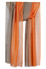Tangerine cashmere stole with a vibrant orange ombré finish in a draped product view